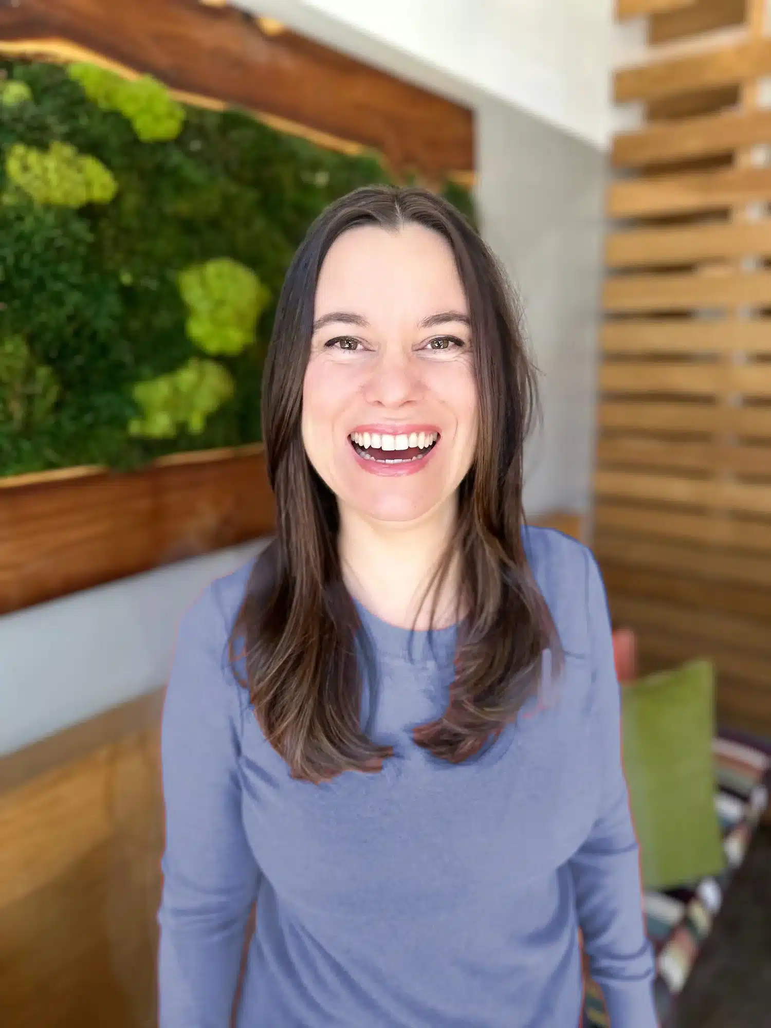 Portrait of Lucy Klein smiling warmly, with an approachable expression conveying trust and compassionate presence