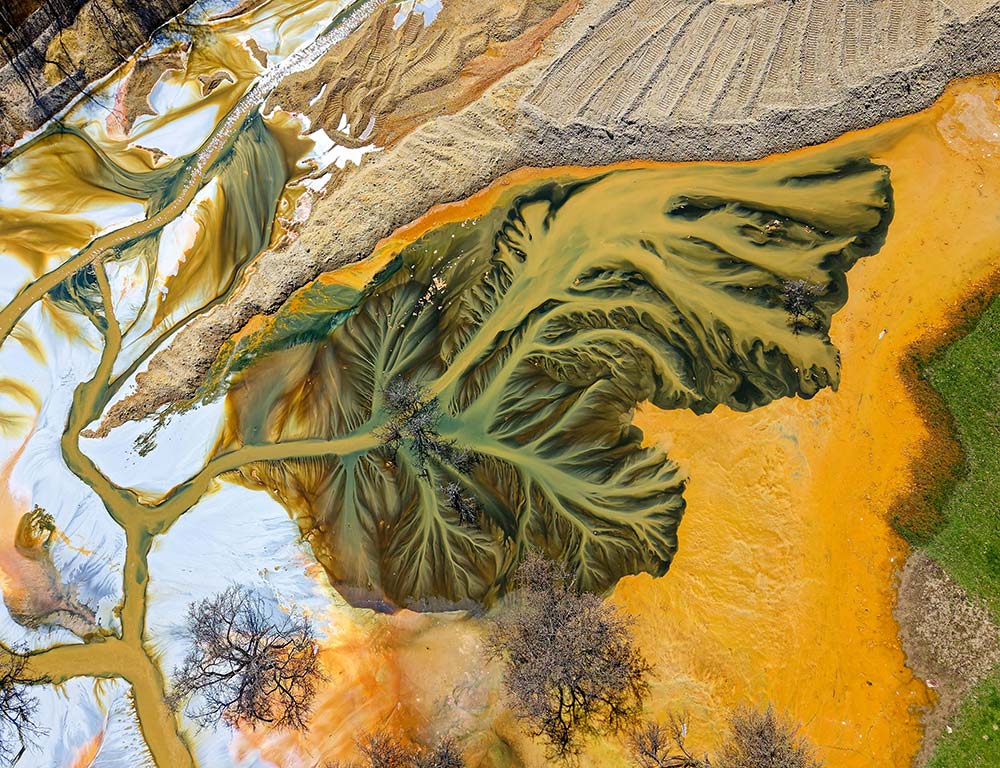 Aerial view of colorful industrial waste creating abstract patterns