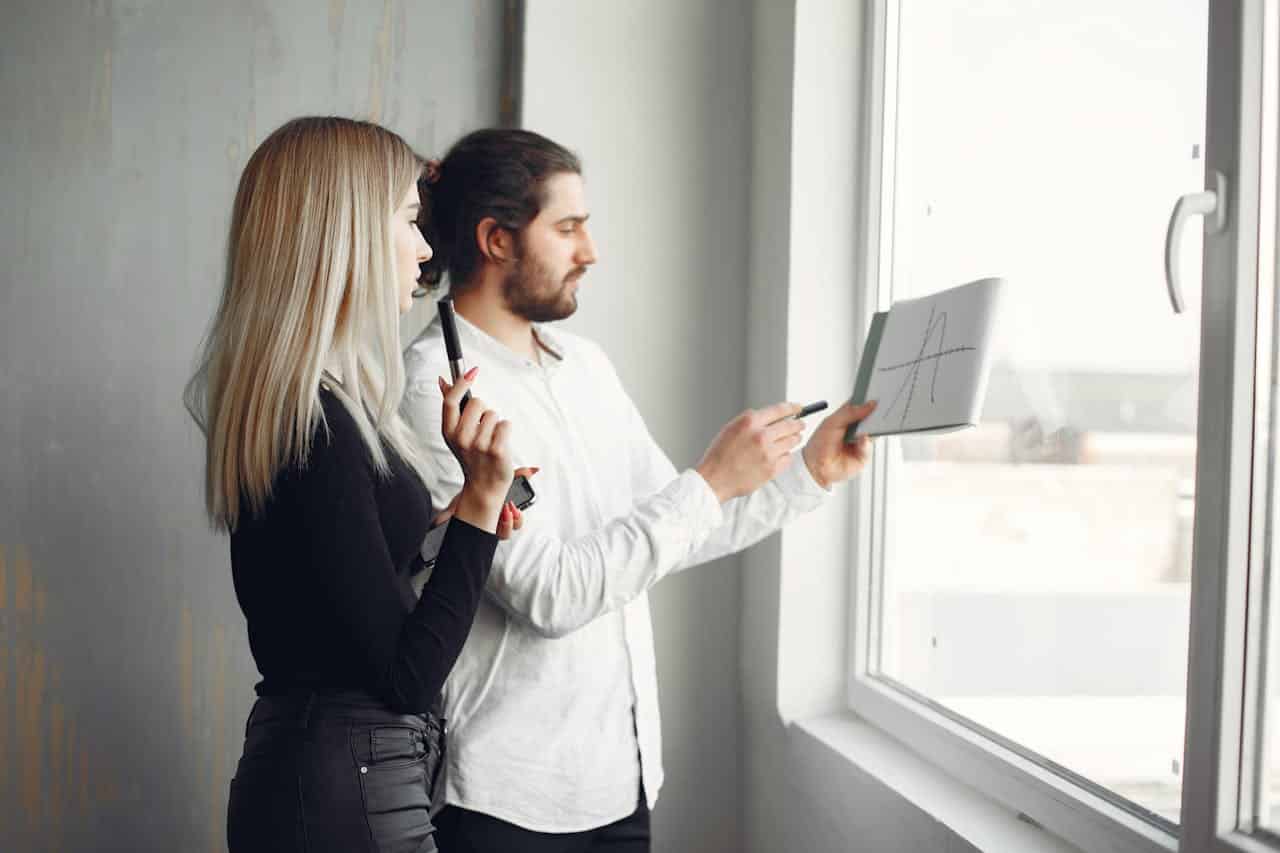 Two startup cofounders standing together during a stressful business period, reflecting leadership pressure and founder burnout.
