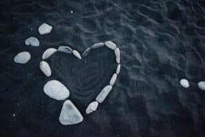 White Heart-Shaped Stones on Blue Water
