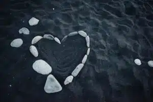 White Heart-Shaped Stones on Blue Water