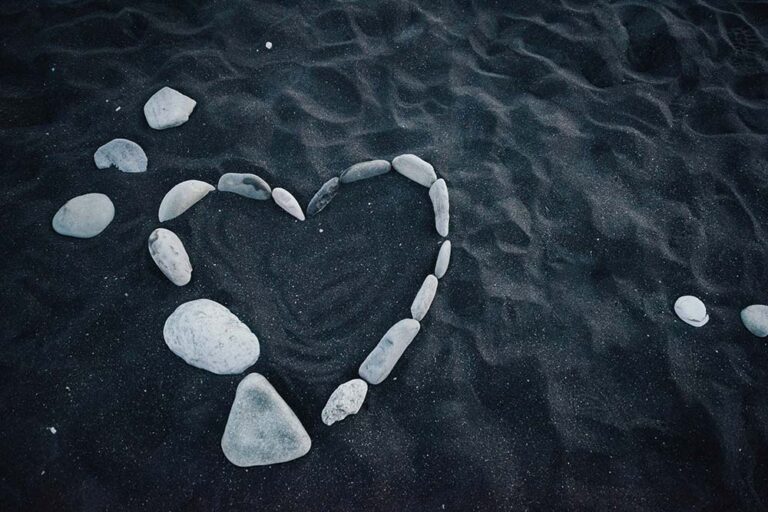 White Heart-Shaped Stones on Blue Water
