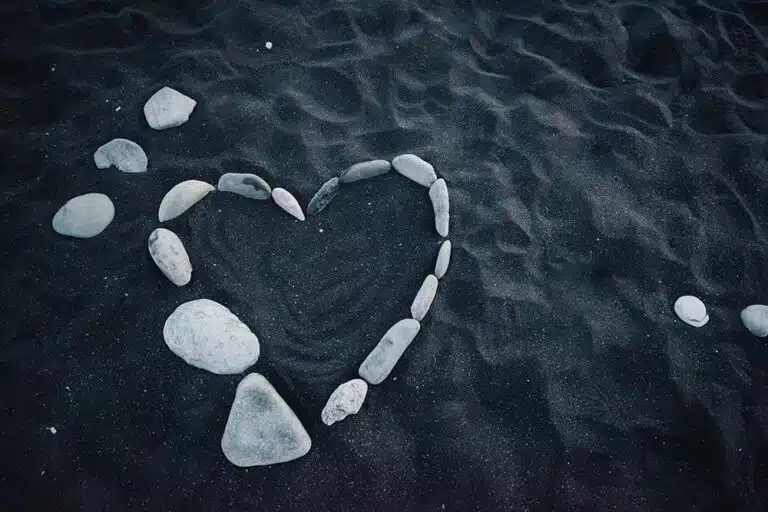 White Heart-Shaped Stones on Blue Water