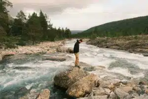 A person standing on a rock