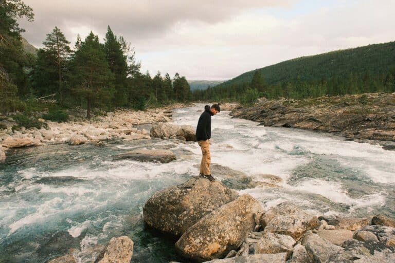A person standing on a rock
