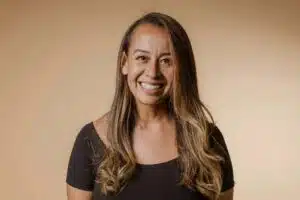 A woman with long hair smiling