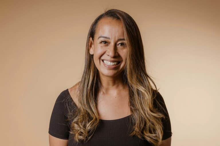 A woman with long hair smiling