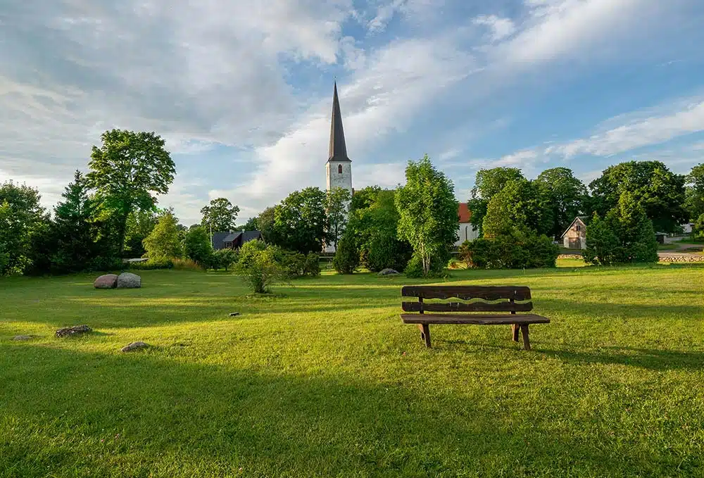 Wooden bench in a village green on Saaremaa